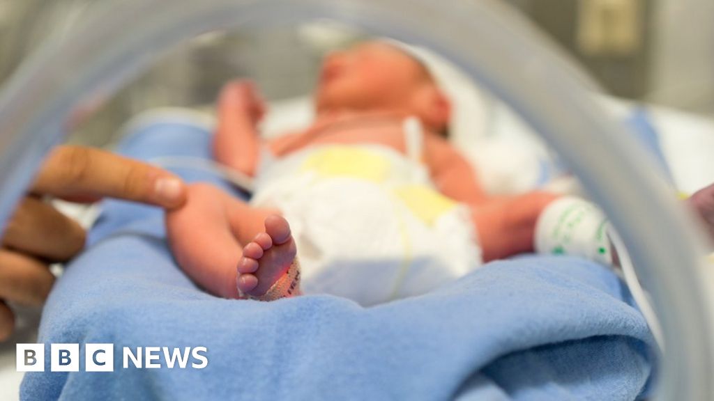 Baby born from three people's DNA in UK first - BBC News